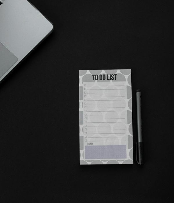 Person doing gentle eye focus exercises in a dark premium office setting